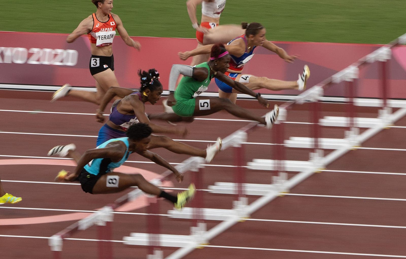Russell Breaks 100m Hurdles World Record at 12.09