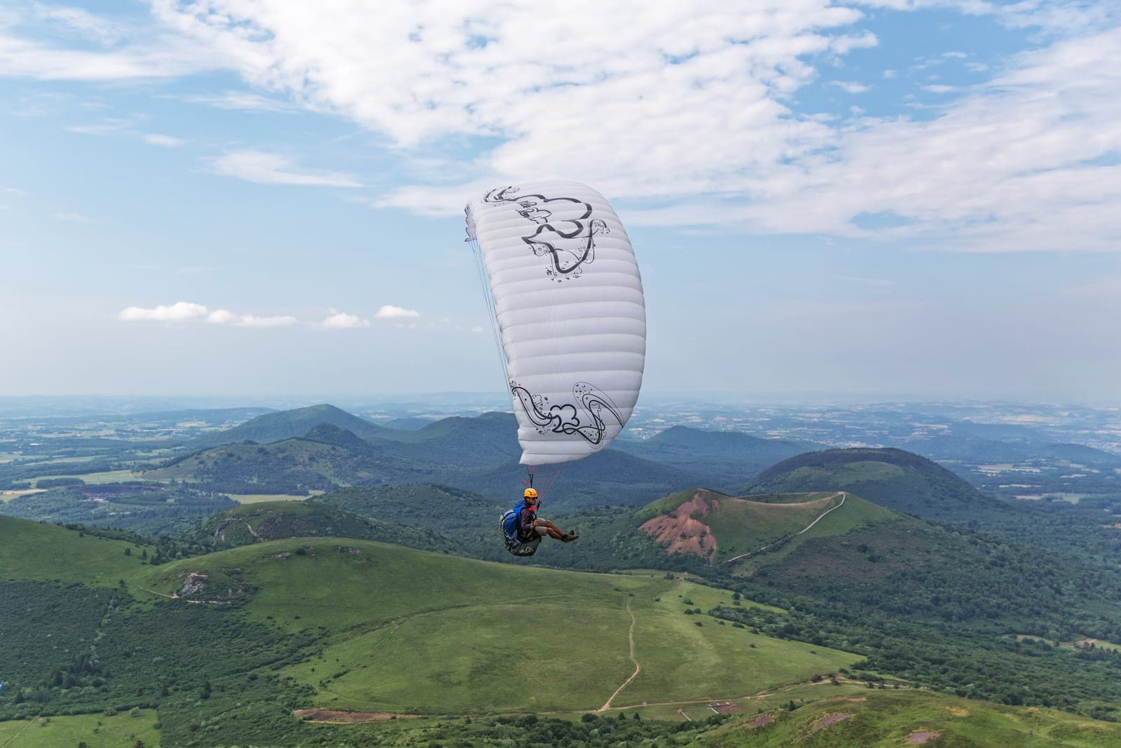 Dutruy Flies First Paraglider Through Ojo de Buey Arch